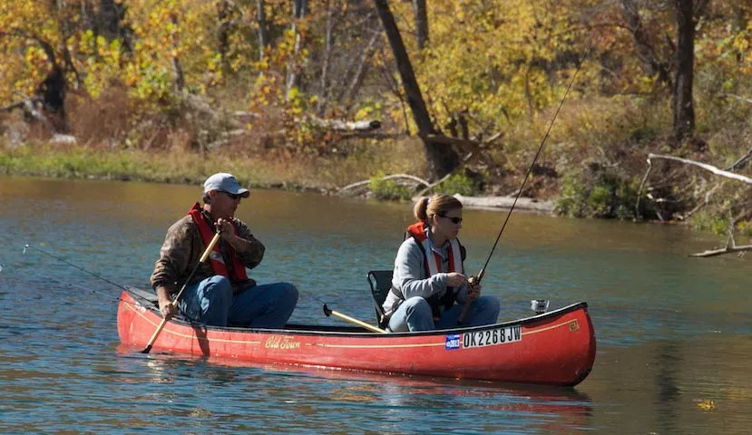 people fall time bass fishing in canoe