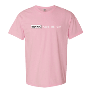 A pink tee shirt that reads "MUNA made me gay".