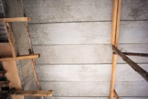 Perspective of structure inside the house under construction. Concrete ceiling and installation of water supply system